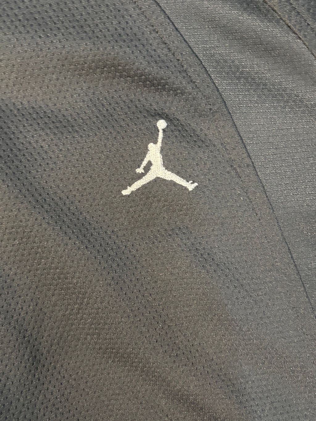 All black Jordan zip up .