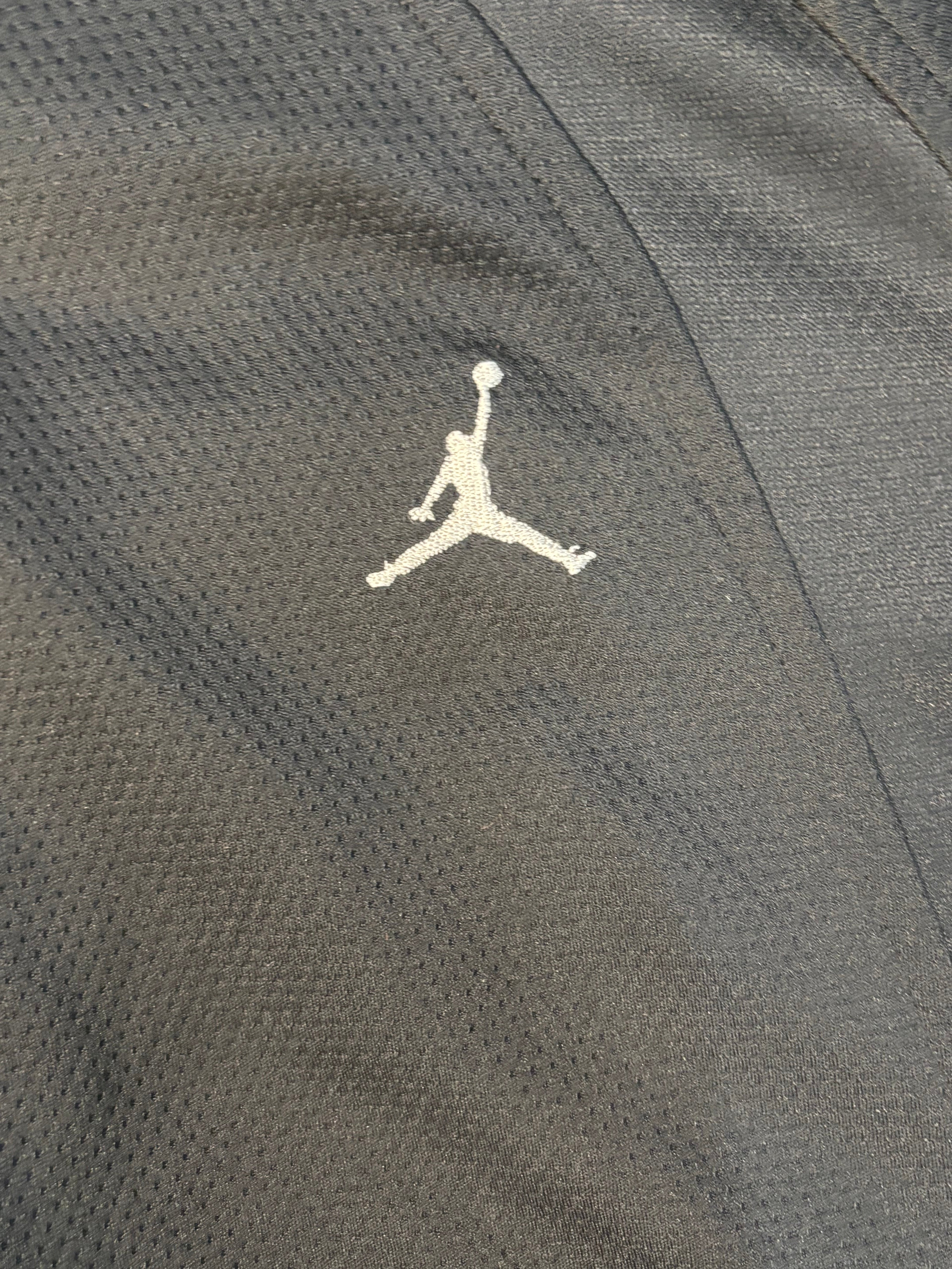 All black Jordan zip up .